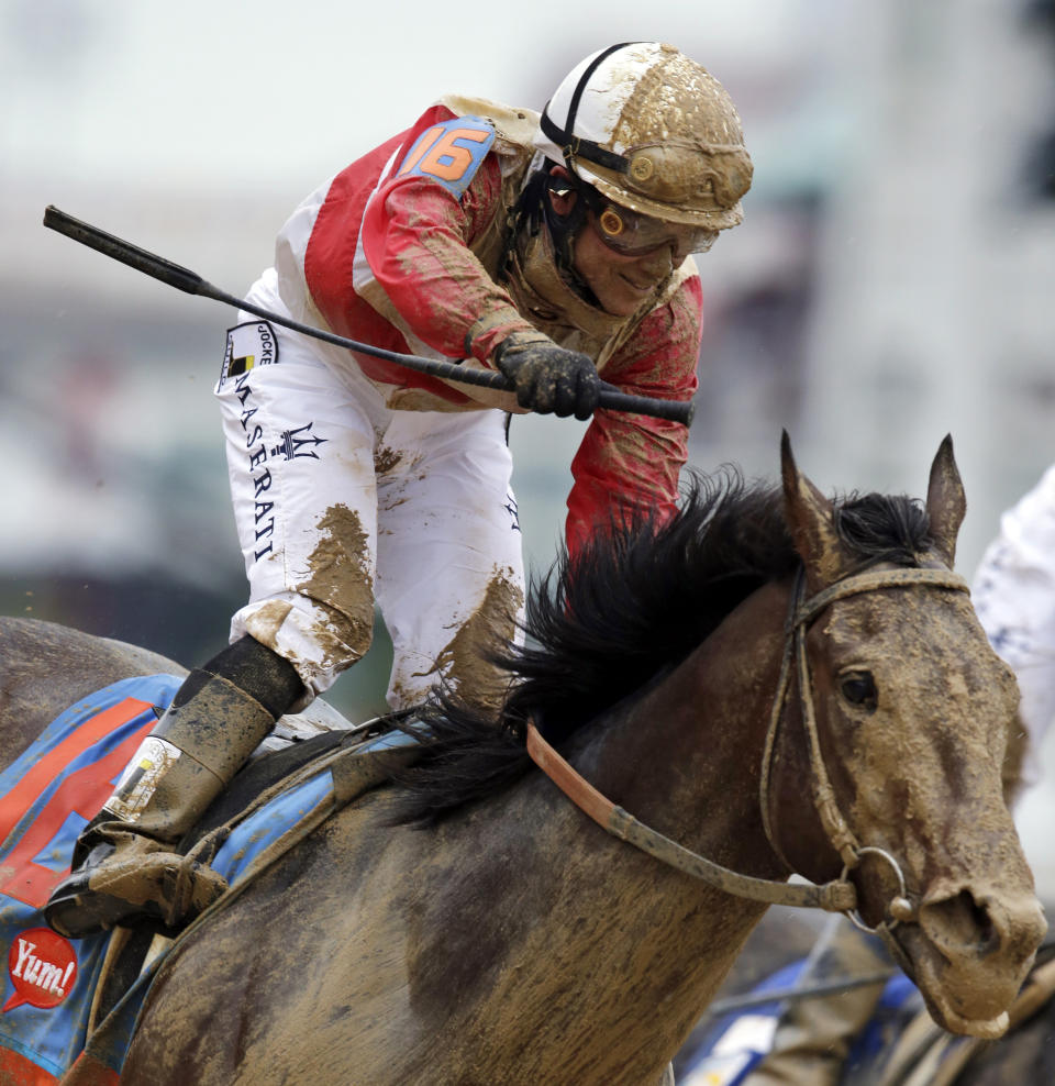 FILE - In this Saturday, May 4, 2013, file photo, jockey Joel Rosario celebrates aboard Orb after winning the 139th Kentucky Derby horse race at Churchill Downs in Louisville, Ky. Triple Crown winner Justify, 2017 Horse of the Year Gun Runner and jockey Joel Rosario have been elected to the National Museum of Racing and Hall of Fame in their first year of eligibility. (AP Photo/Darron Cummings, File)