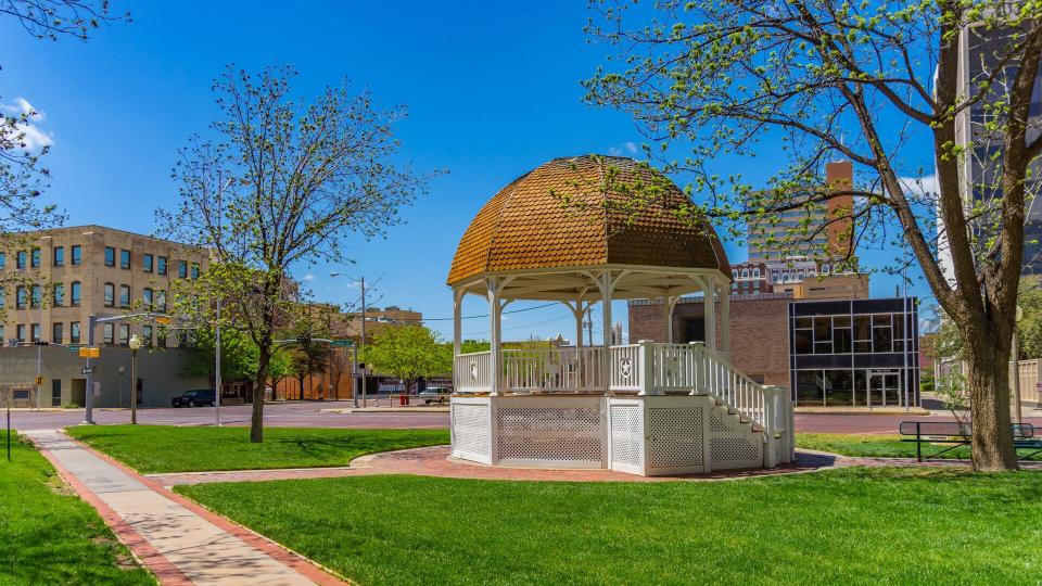 Spring begins in the downtown Lubbock with a white gazebo and walkway ,Texas.