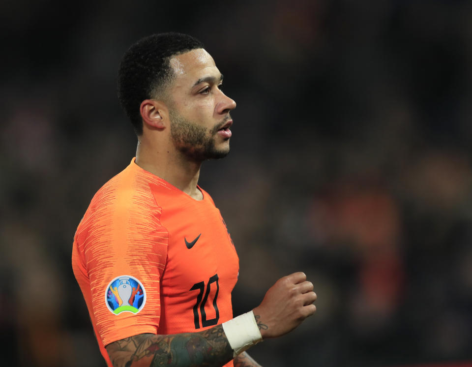 Netherlands' Memphis Depay celebrates after scoring his side's third goal during their Euro 2020 group C qualifying soccer match between Netherlands and Belarus at the Feyenoord stadium in Rotterdam, Netherlands, Thursday, March 21, 2019. (AP Photo/Peter Dejong)