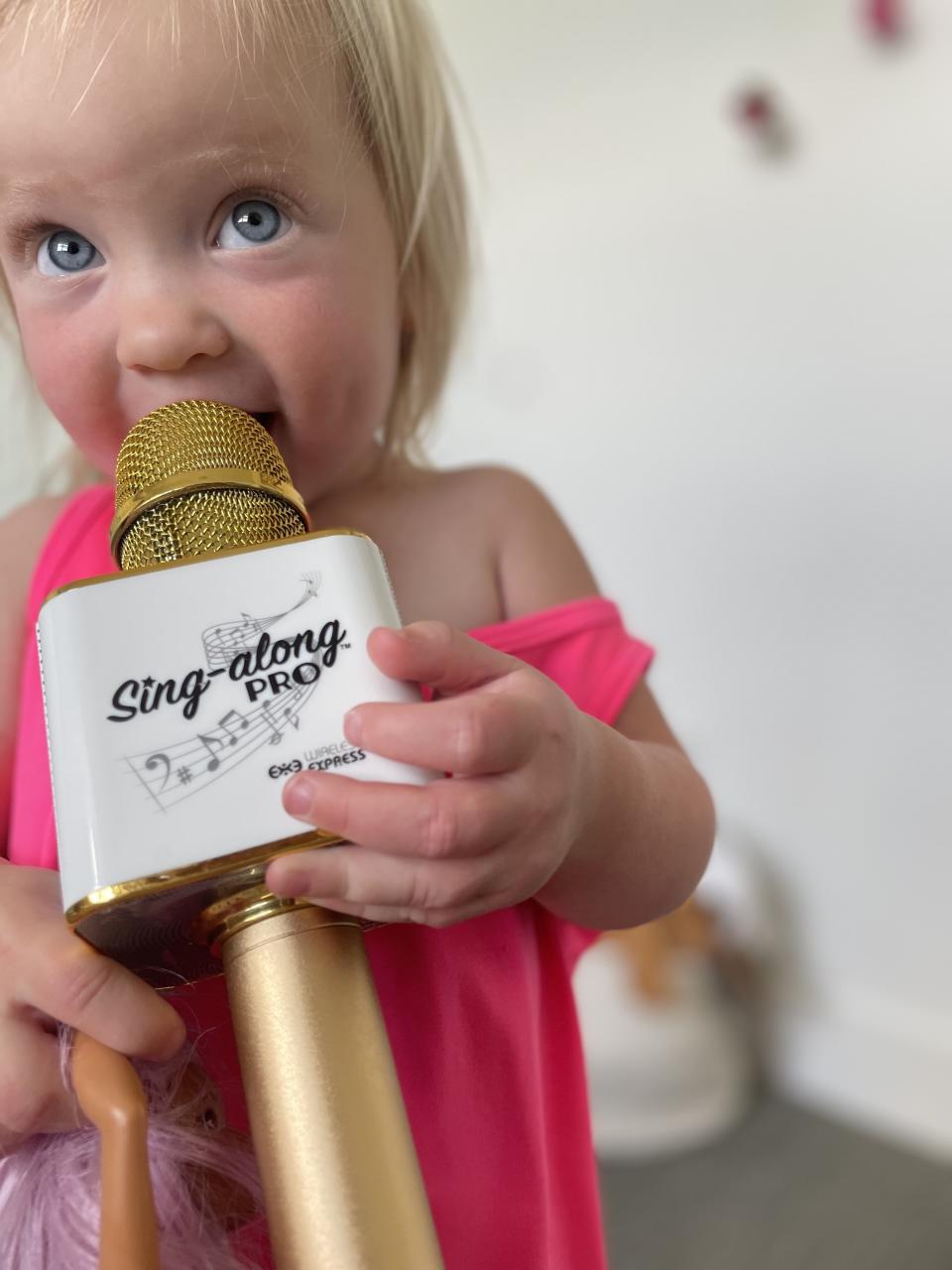 author's daughter with a microphone