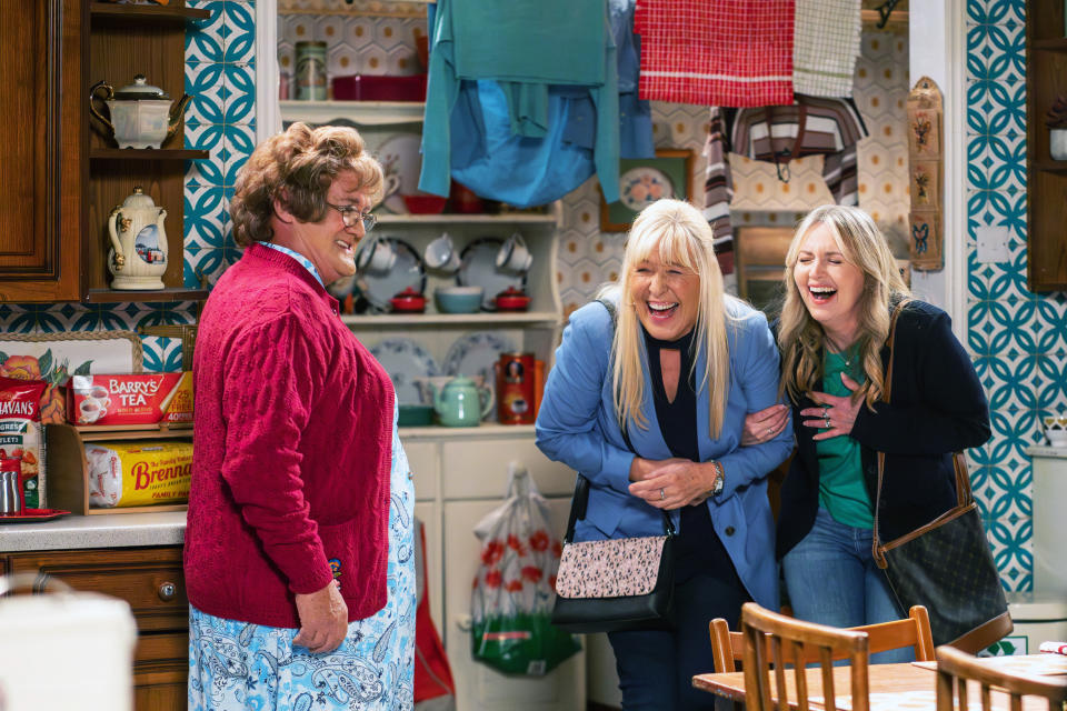 Debra, Brendan and Jennifer laughing on set.