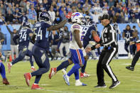 Tennessee Titans inside linebacker Rashaan Evans (54) runs past Buffalo Bills running back Zack Moss (20) as Evans celebrates stopping the Bills at the 3-yard line to end their final drive in the closing seconds of the fourth quarter of an NFL football game Monday, Oct. 18, 2021, in Nashville, Tenn. The Titans won 34-31. (AP Photo/Mark Zaleski)