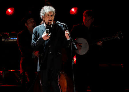 Singer Bob Dylan performs during a segment honoring Director Martin Scorsese, recipient of the Music+ Film Award, at the 17th Annual Critics' Choice Movie Awards in Los Angeles January 12, 2012. REUTERS/Mario Anzuoni/File Photo