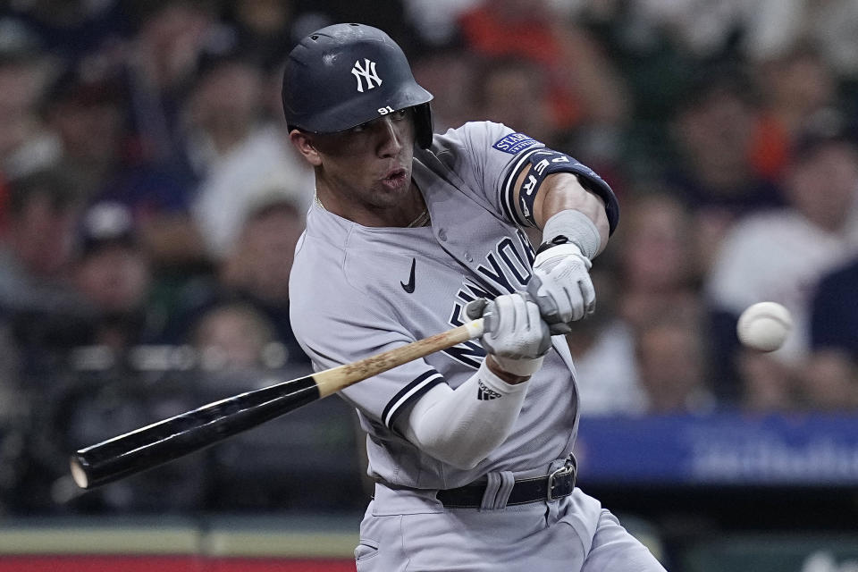 New York Yankees' Oswald Peraza hits an RBI single against the Houston Astros during the second inning of a baseball game Saturday, Sept. 2, 2023, in Houston. (AP Photo/Kevin M. Cox)