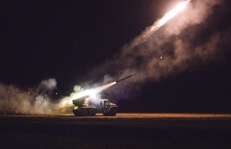 Ukrainian servicemen launch a Grad rocket towards pro-Russian separatist forces outside Debaltseve, eastern Ukraine February 8, 2015. REUTERS/Alexei Chernyshev