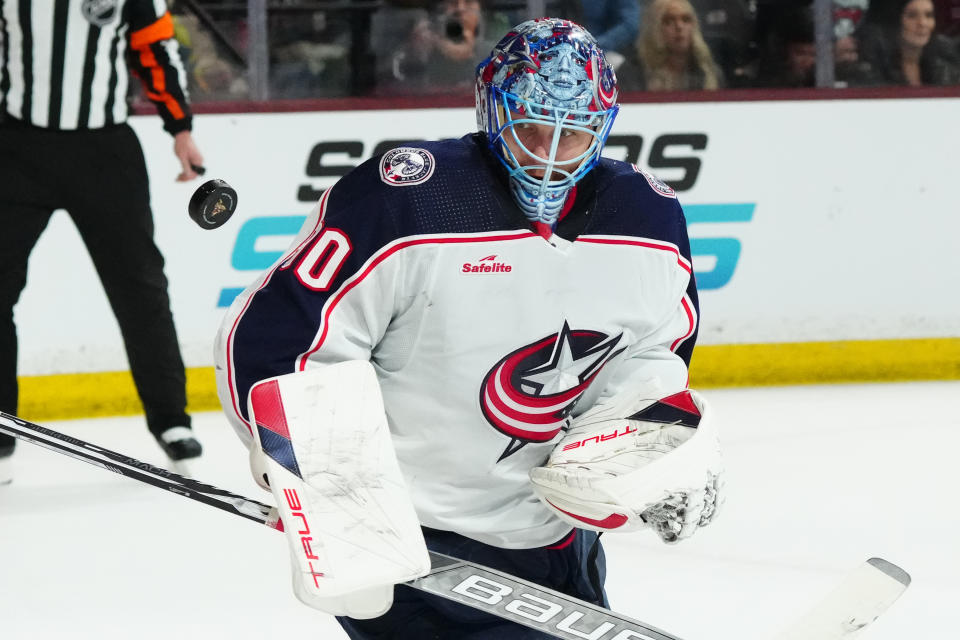 Columbus Blue Jackets goaltender Elvis Merzlikins makes a save against the Arizona Coyotes during the first period of an NHL hockey game Tuesday, March 26, 2024, in Tempe, Ariz. (AP Photo/Ross D. Franklin)