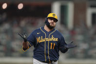 Milwaukee Brewers' Rowdy Tellez celebrates after hitting a two-run homer during the fifth inning of Game 4 of a baseball National League Division Series against the Atlanta Braves, Tuesday, Oct. 12, 2021, in Atlanta. (AP Photo/Brynn Anderson)