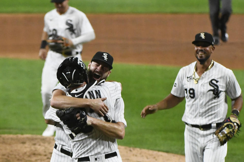 Chicago White Sox starting pitcher Lucas Giolito celebrates with catcher James McCann (33) after closing out a no-hitter in the team's baseball game against the Pittsburgh Pirates, Tuesday, Aug. 25, 2020, in Chicago. The White Sox won 4-0. (AP Photo/Matt Marton)