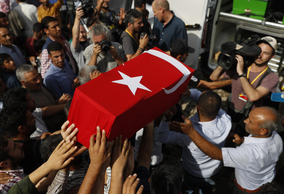 Mourners carry the coffin of ten-month-old Mohammed Omar Saar, killed during incoming shelling from Syria Thursday, in Akcakale, Sanliurfa province, southeastern Turkey, at the border with Syria, Friday, Oct. 11, 2019. (AP Photo/Lefteris Pitarakis)