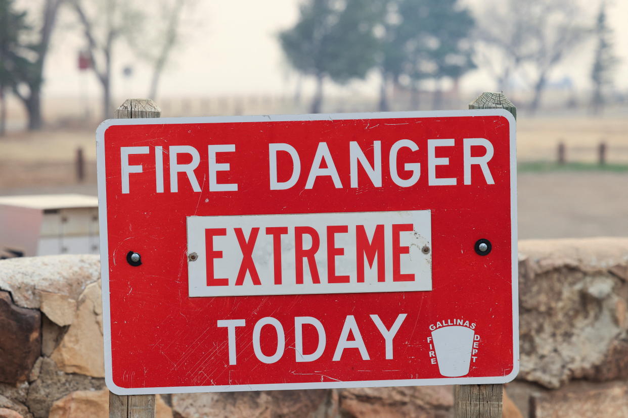 A sign indicating extreme fire danger is pictured at Storrie Lake State Park as the Hermits Peak and Calf Canyon wildfires burn near Las Vegas, New Mexico, May 2, 2022. REUTERS/Kevin Mohatt