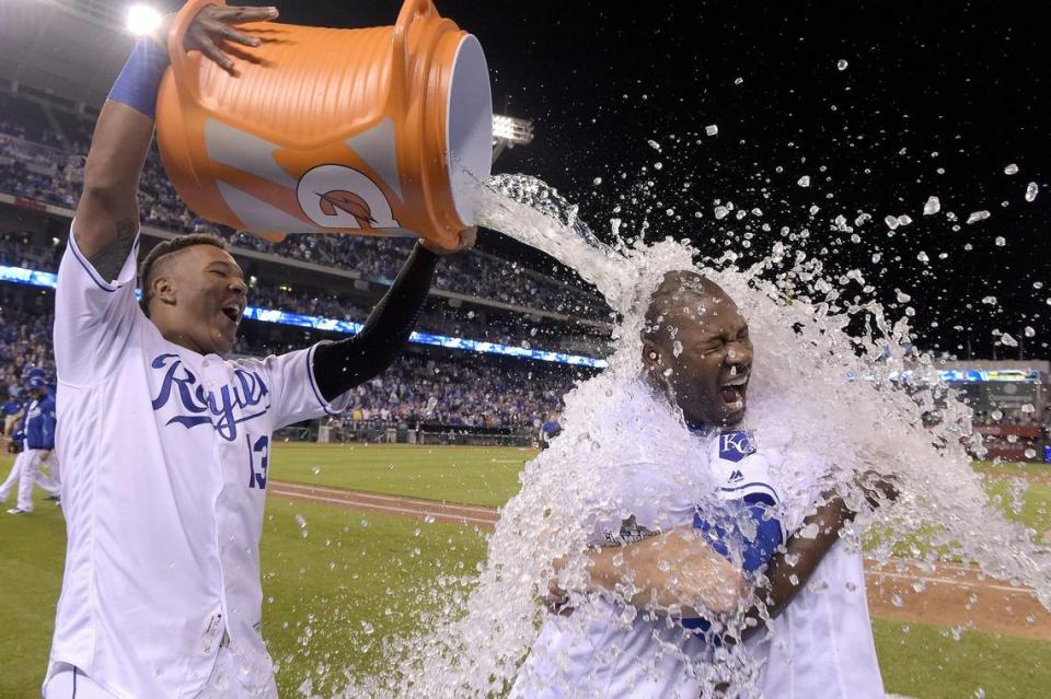 Kansas City Royals’ Lorenzo Cain and Mike Moustakas hold onto each other as Salvador Perez delivers the Gatorade shower after the teams 7-6 win over the Washington Nationals during a game on May 3, 2016 at Kauffman Stadium in Kansas City, Mo.