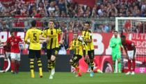 Football Soccer - Bayern Munich v Borussia Dortmund - Bundesliga - Allianz Arena, Munich, Germany - 8/4/17 Borussia Dortmund players celebrate after Raphael Guerreiro (not pictured) scored their first goal Reuters / Michael Dalder Livepic