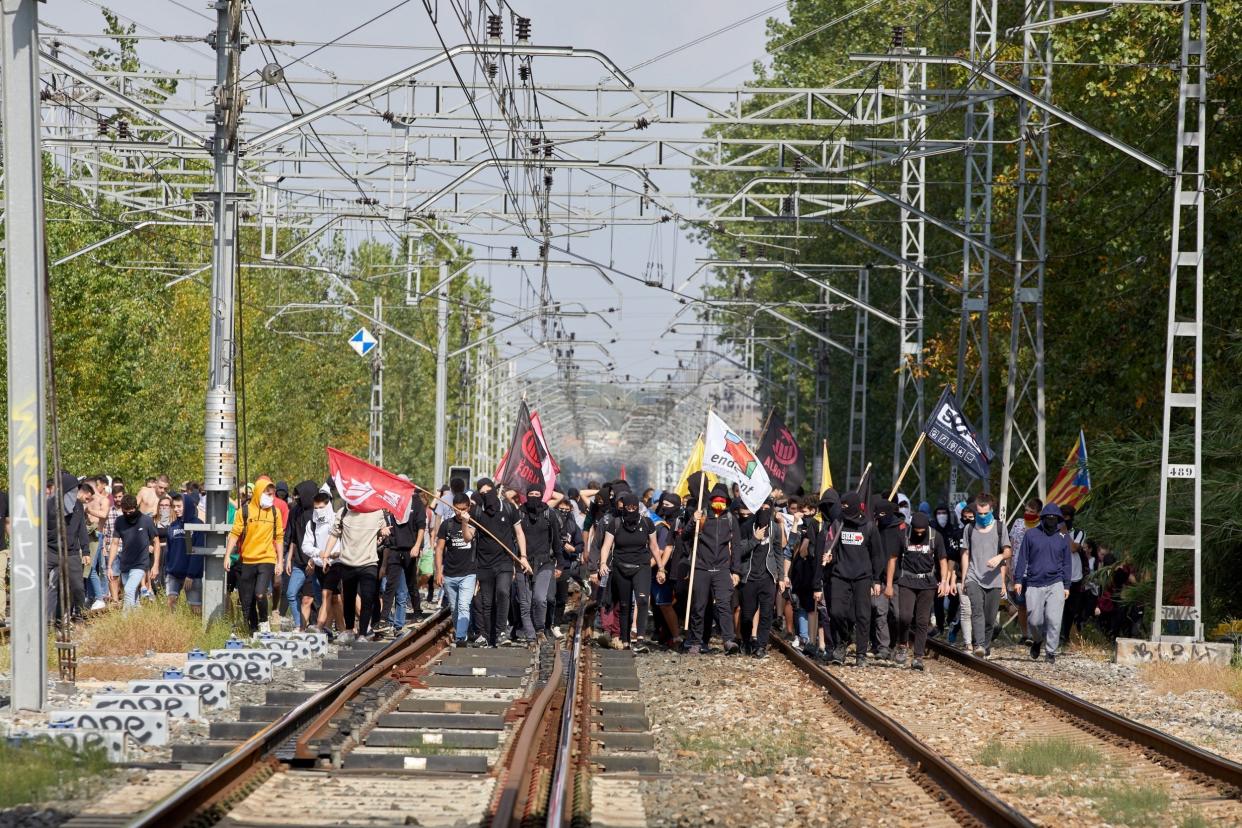 People block the railway track of the high speed train AVE to protest against the sentences in Gerona, Catalonia on Monday: EPA