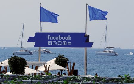 The logo of the social network Facebook is seen on a beach during the Cannes Lions in Cannes, France, June 21, 2017. REUTERS/Eric Gaillard/Files