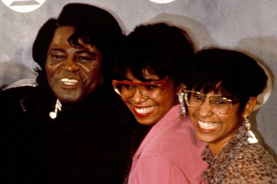 <p>Ebet Roberts/Redferns</p> James Brown and his daughters in New York City