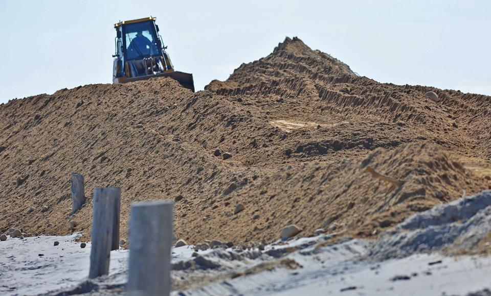 Beach build-up work continues to renovate and reclaim Duxbury Beach area that are subject to storm erosion on Thursday, Feb. 22, 2024. Thousands of yards of sand are being used to raise the level of the barrier beach.