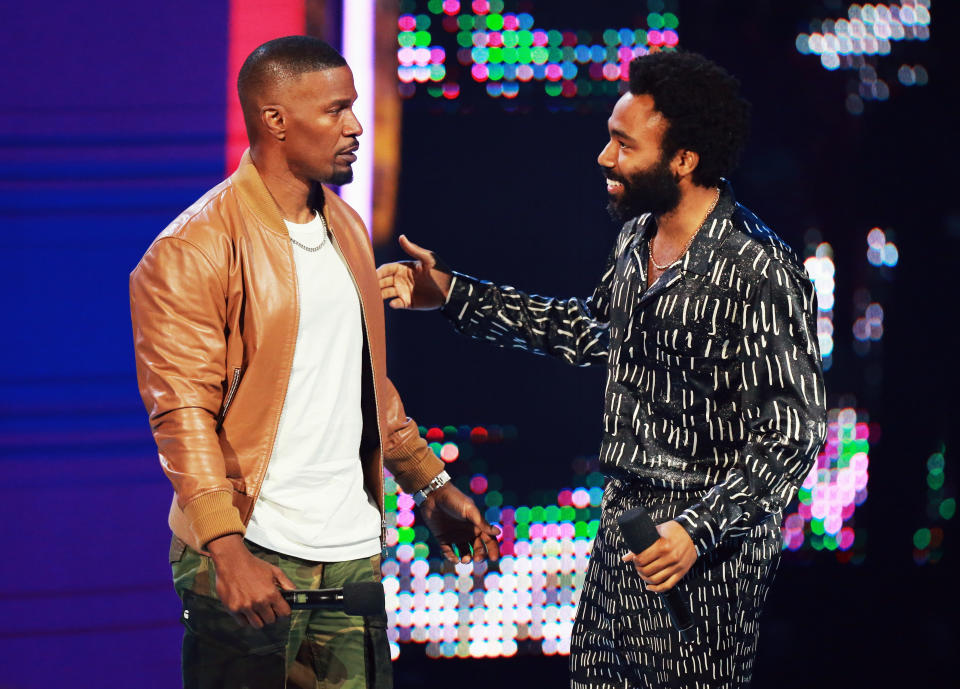 Host Jamie Foxx and Donald Glover onstage at the BET Awards. (Photo: Leon Bennett via Getty Images)