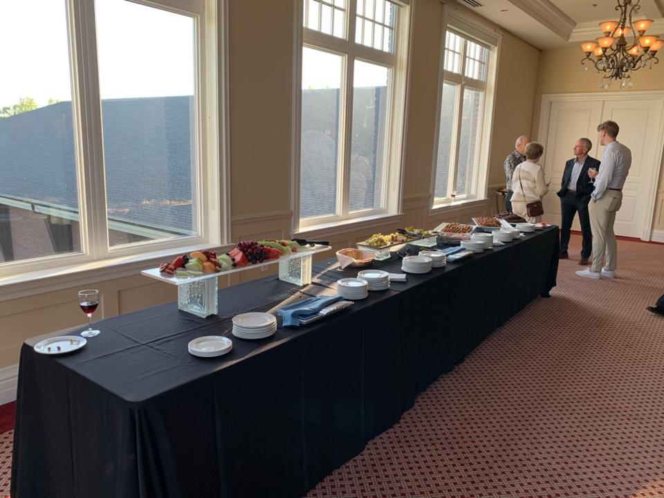 Tables were set up in the room, where guests could enjoy fruit, cookies and crackers. Servers also circled around, offering red and white wine to attendees.