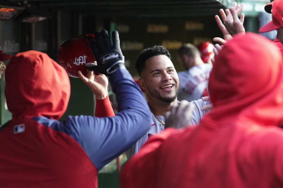 St. Louis Cardinals' Willson Contreras celebrates in the dugout after scoring off Dylan Carlson's single during the second inning of a baseball game against the Chicago Cubs, Monday, May 8, 2023, in Chicago. (AP Photo/Charles Rex Arbogast)