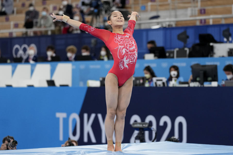 Tang Xijing, of China, performs on the balance beam during the artistic gymnastics women's apparatus final at the 2020 Summer Olympics, Tuesday, Aug. 3, 2021, in Tokyo, Japan. (AP Photo/Ashley Landis)