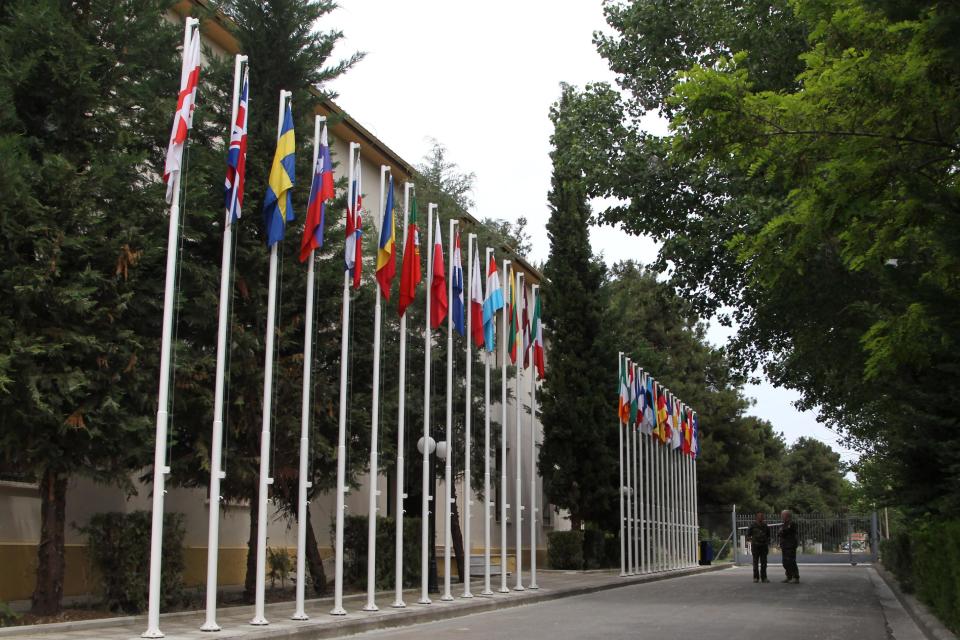 Officers chat out of the operational headquarters of the European Union’s force for the Central African Republic, in the central Greek town of Larissa, Tuesday, May, 13, 2014. The force recently began deploying in the African country’s capital, and currently has 235 troops, mainly securing the airport. It expects to have more than 800 troops on the ground by mid-June for a six-month deployment. The Central African Republic has been wracked by sectarian bloodshed for months, leaving thousands dead and forcing nearly 1 million people to flee their homes.(AP Photos/Nikolas Giakoumidis)