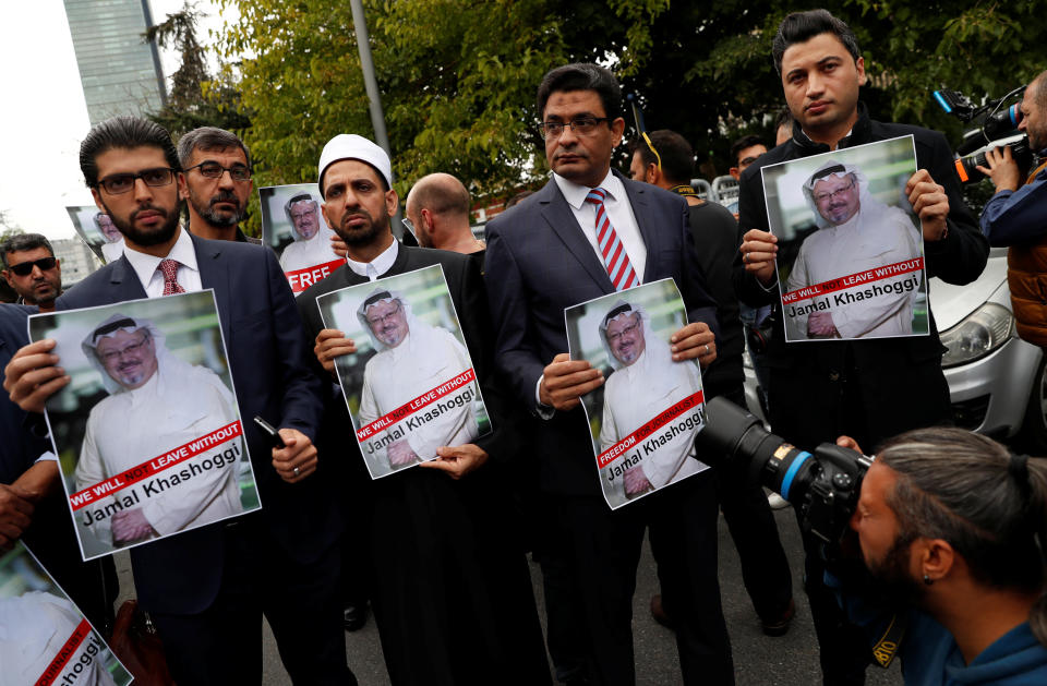 Human rights activists and friends of Saudi journalist Jamal Khashoggi hold his picture during a protest outside the Saudi Consulate in Istanbul, Turkey, Oct. 8. (Photo: Murad Sezer / Reuters)