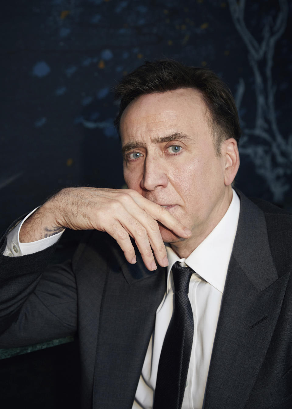 Nicolas Cage poses for a portrait to promote "The Unbearable Weight of Massive Talent" in New York on April 9, 2022. (Photo by Taylor Jewell/Invision/AP)