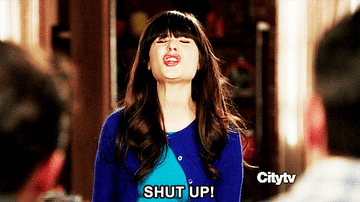 Zooey Deschanel as Jess Day in "New Girl" yells "SHUT UP!" with her eyes closed