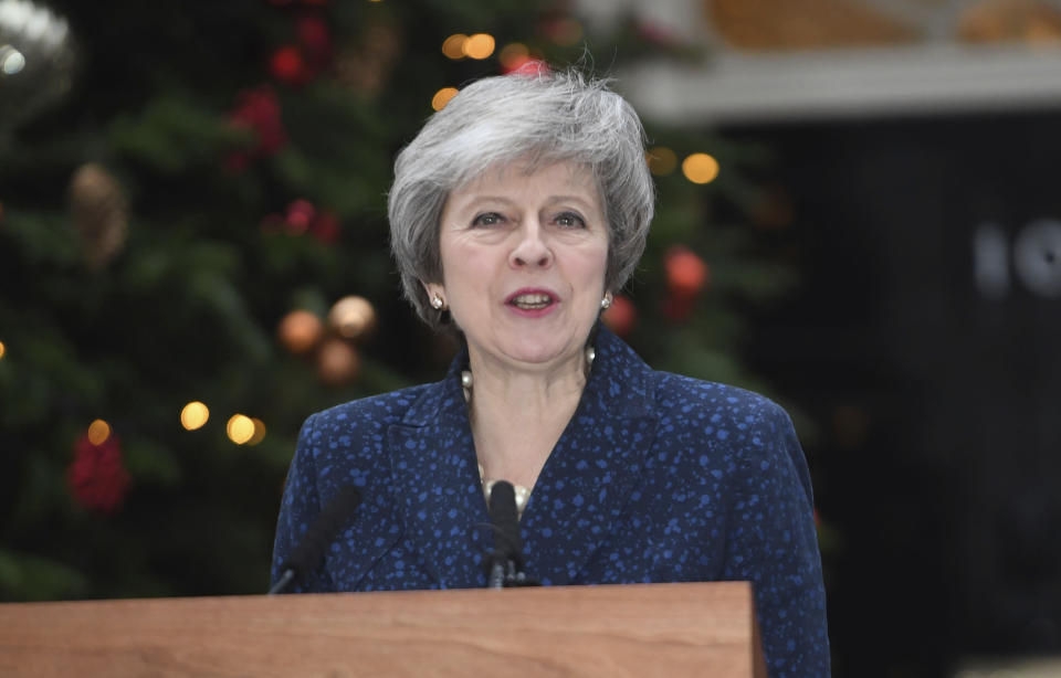 Britain's Prime Minister Theresa May makes a media statement in Downing Street, London, confirming there will be a vote of confidence in her leadership of the Conservative Party, Wednesday Dec. 12, 2018. The vote of confidence will be held in Parliament Wednesday evening, with the result expected to be announced soon after. (Stefan Rousseau/PA via AP)