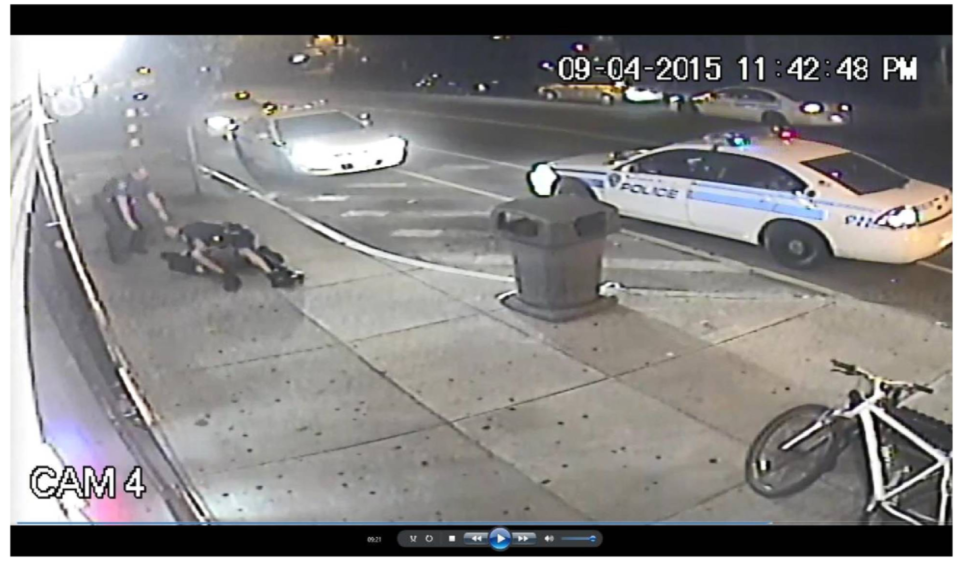 Rochester police officers hold down David Vann outside a South Wedge convenience store on Sept. 4, 2015, as soon in this surveillance footage still from a lawsuit filed by Vann in 2018.