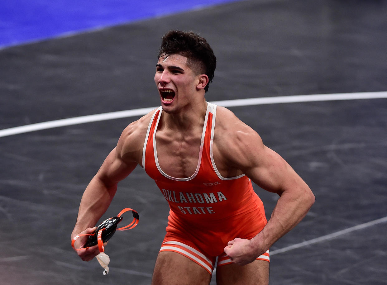 Mar 19, 2021; St. Louis, Missouri, USA; Oklahoma State Cowboys wrestler AJ Ferrari celebrates after defeating Michigan State Wolverines wrestler Myles Amine in the 197 weight class during the semifinals of the NCAA Division I Wrestling Championships at Enterprise Center. Mandatory Credit: Jeff Curry-USA TODAY Sports