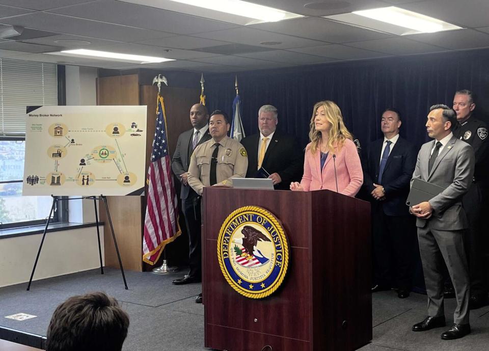 Anne Milgram talks during a news conference