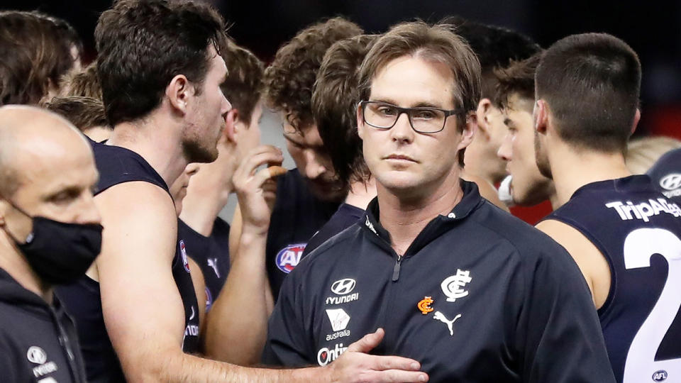 Seen here, Carlton coach David Teague looks. upset after an AFL game.