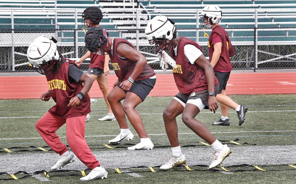 Weymouth High football players run through an agility drill on Monday, Aug. 21, 2023.