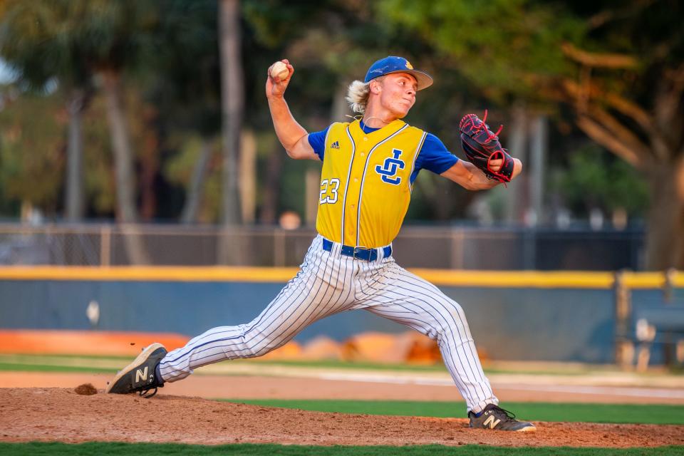 John Carroll Catholic pitcher Colt Miller (23) delivers a pitch against Trinity Christian Academy in a high school baseball Region 4-2A semifinal Saturday, May 11, 2024, at the Lawnwood Baseball Complex in Fort Pierce.