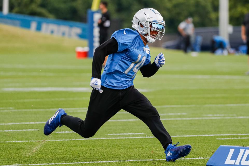Lions wide receiver Amon-Ra St. Brown practices during the first day of training camp July 27, 2022 in Allen Park.