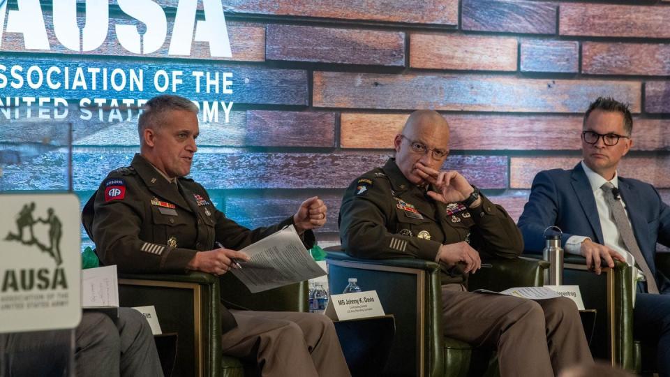 Lt. Gen. Douglas Stitt and Maj. Gen. Johnny Davis answer questions at a recruiting panel discussion during the AUSA 2023 Annual Meeting and Exposition at the Walter E. Washington Convention Center in Washington, D.C., Oct. 9, 2023. (Sgt. Deonte Rowell/Army)