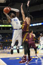 Pittsburgh's Jamarius Burton (11) shoots as Minnesota's E.J. Stephens (20) defends during the first half of an NCAA college basketball game Tuesday, Nov. 30, 2021, in Pittsburgh. (AP Photo/Keith Srakocic)