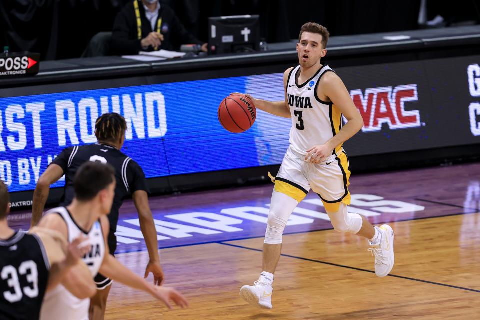 Iowa guard Jordan Bohannon brings the ball up the court.