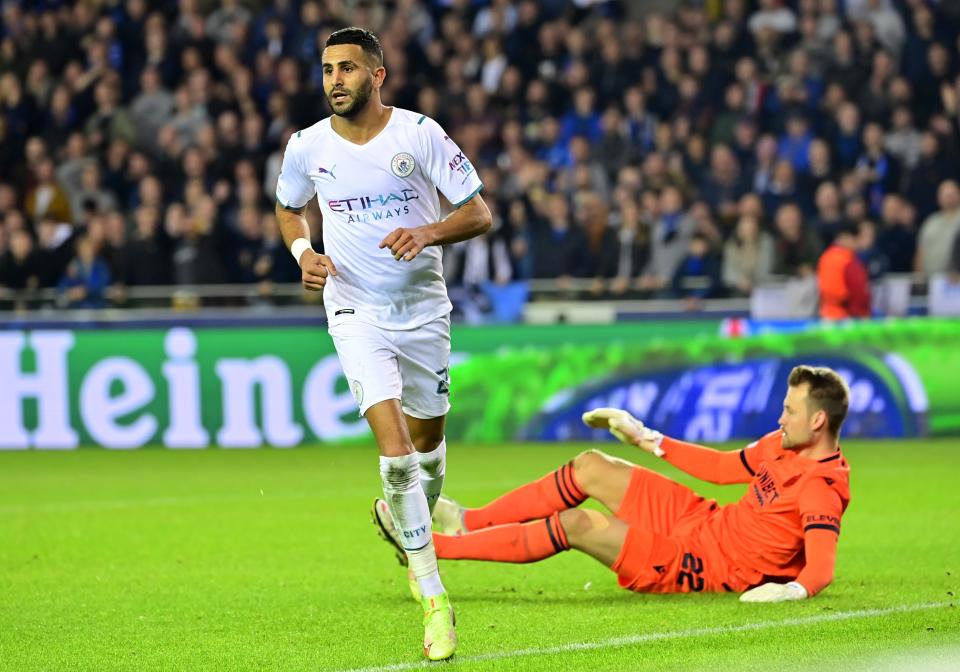 Simon Mignolet goalkeeper (pictured right) on the floor after Riyad Mahrez (pictured left) celebrates scoring a goal against Club Brugge.