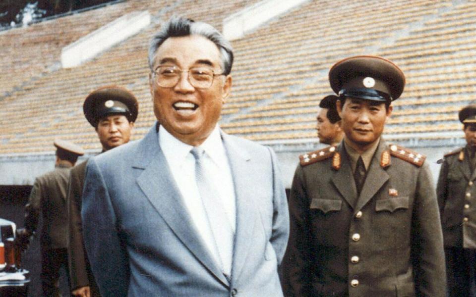 Kim Il-Sung (L), inspecting a football ground in Pyongyang - Credit: KNS/AFP/Getty Images