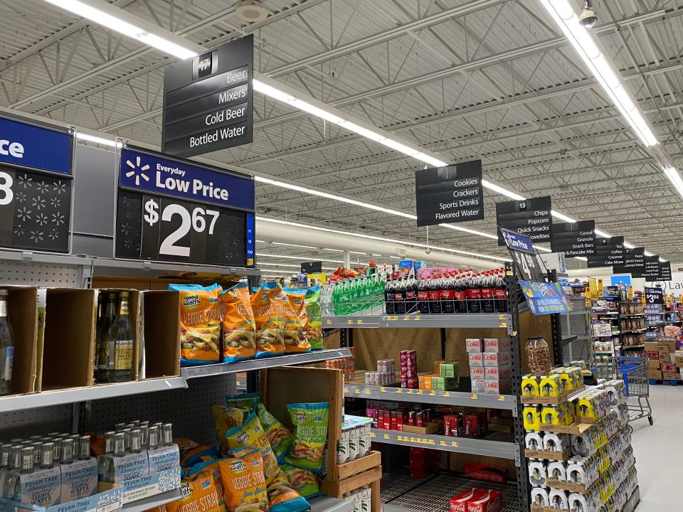 Eight grocery aisles at walmart filled with food and groceries