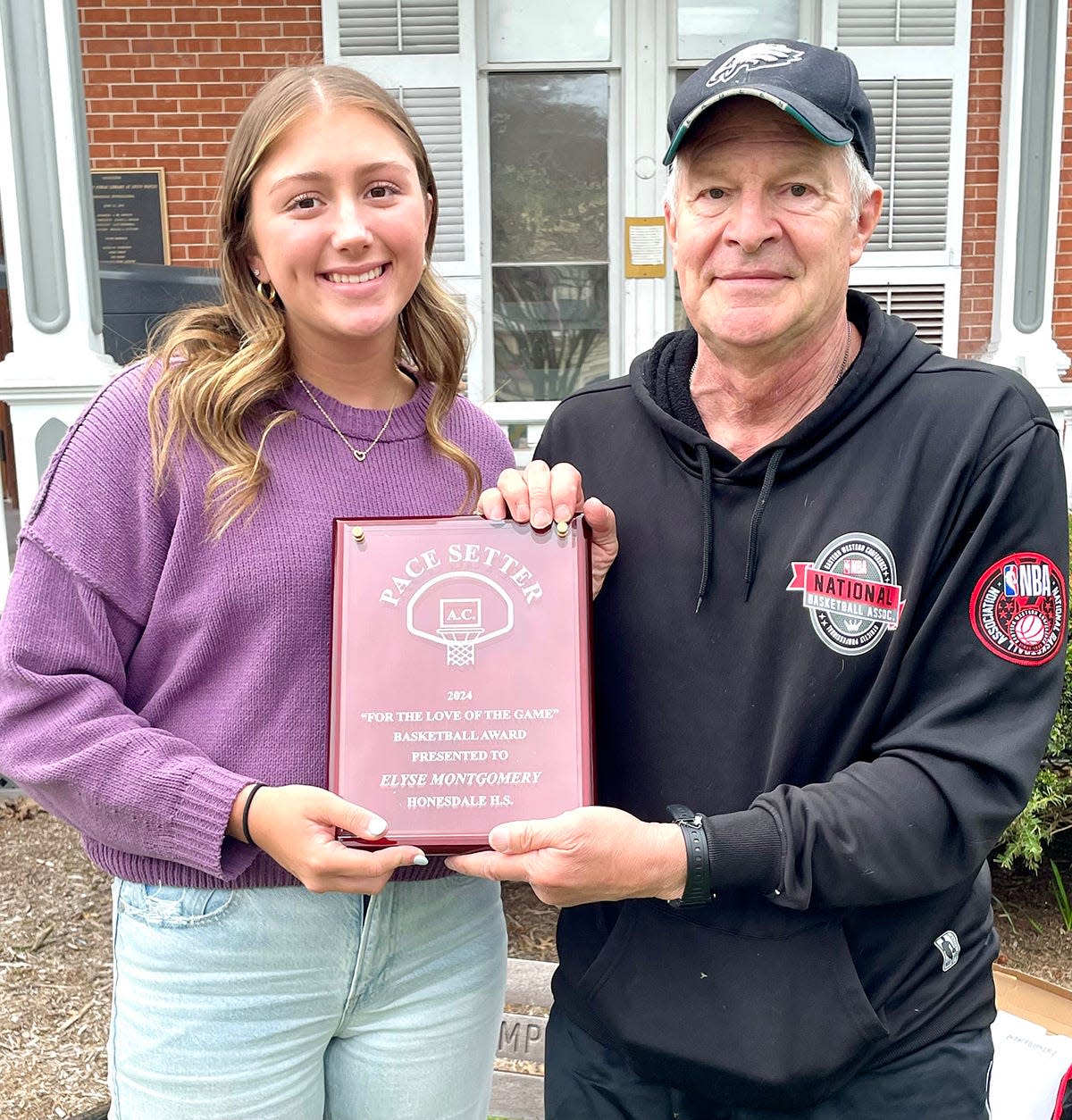 Honesdale's Elyse Montgomery has been named the 2023-24 recipient of the Pacesetters "For the Love of the Game" award. She is pictured here with Pacesetter AC co-counder Ron Elias.