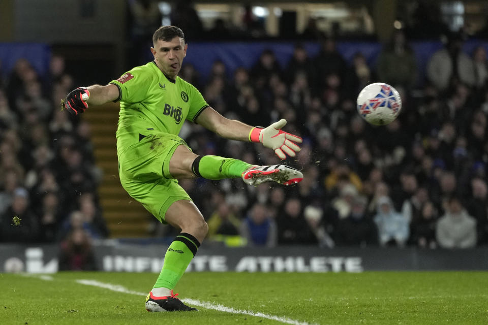 Aston Villa's goalkeeper Emiliano Martinez plays the ball during the English FA Cup fourth round soccer match between Chelsea and Aston Villa at the Stamford Bridge stadium in London, Friday, Jan. 26, 2024. (AP Photo/Kin Cheung)