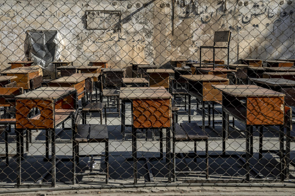 The benches of a school sits empty in Kabul, Afghanistan, Thursday, Dec. 22, 2022. The country's Taliban rulers earlier this week ordered women nationwide to stop attending private and public universities effective immediately and until further notice. They have banned girls from middle school and high school, barred women from most fields of employment and ordered them to wear head-to-toe clothing in public. Women are also banned from parks and gyms.(AP Photo/Ebrahim Noroozi)