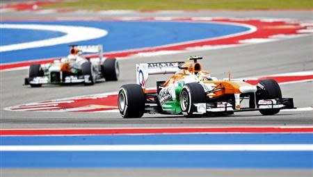 Force India Formula One driver Adrian Sutil of Germany (R) and Force India Formula One driver Paul di Resta of Britain drive during the third practice session of the U.S. F1 Grand Prix at the Circuit of the Americas in Austin, Texas November 16, 2013. REUTERS/Mike Stone