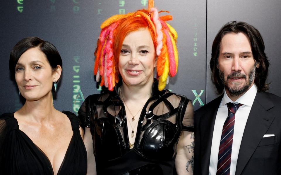 Lana Wachowski and actors Carrie-Anne Moss and Keanu Reeves promoting Matrix Resurrections - Reuters