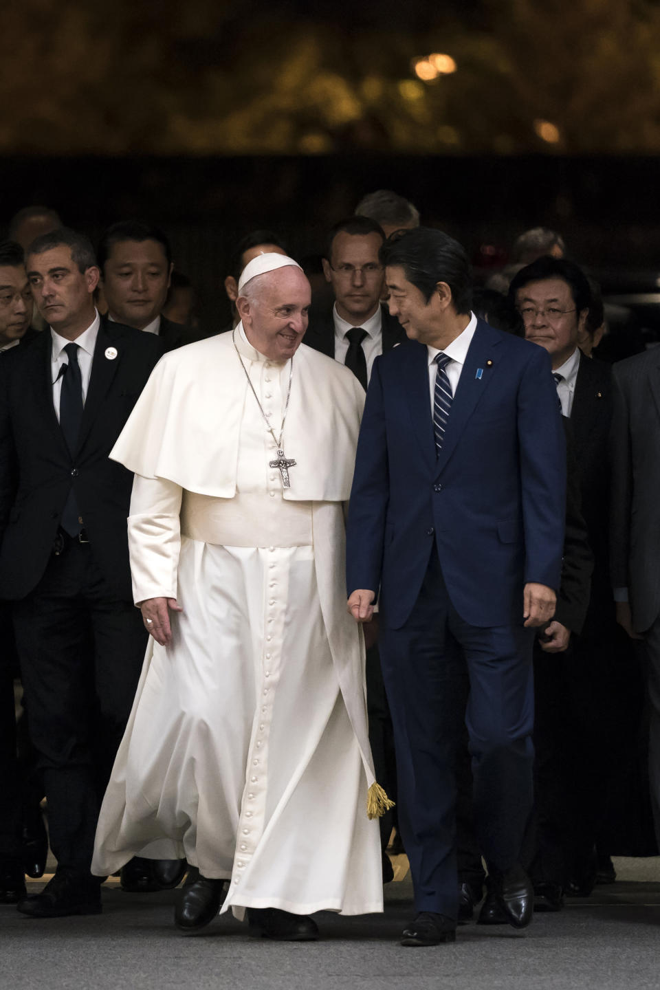 Pope Francis walks with Japan's Prime Minister Shinzo Abe as he arrives at the prime minister's official residence Monday, Nov. 25, 2019 in Tokyo. (Tomohiro Ohsumi/Pool Photo via AP)