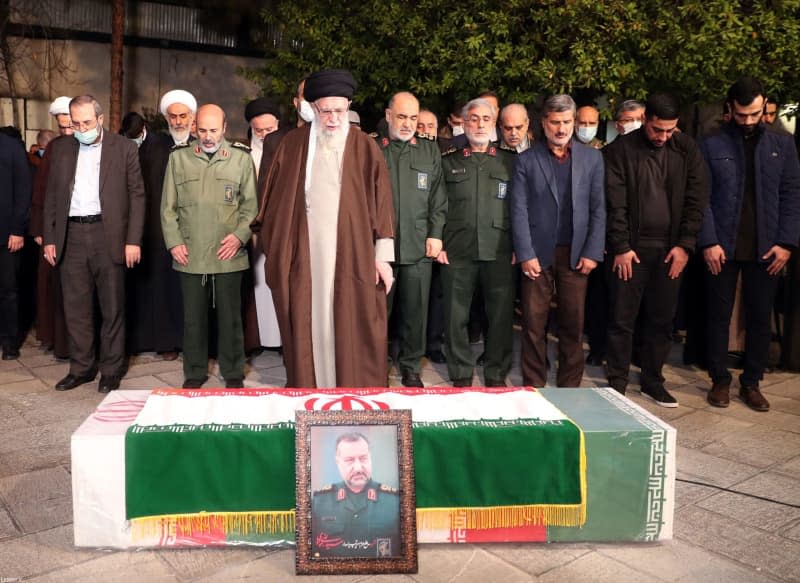 Supreme Leader Ayatollah Ali Khamenei stands before the coffin of senior Iranian commander Seyed Razi Mousavi, who Tehran says was killed in an Israeli airstrike in Syria. -/Iranian Supreme Leader's Office/dpa