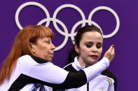 <p>Italy’s Anna Cappellini reacts after she and parter Italy’s Luca Lanotte competed in the ice dance free dance of the figure skating event during the Pyeongchang 2018 Winter Olympic Games at the Gangneung Ice Arena in Gangneung on February 20, 2018. / AFP PHOTO / ARIS MESSINIS </p>